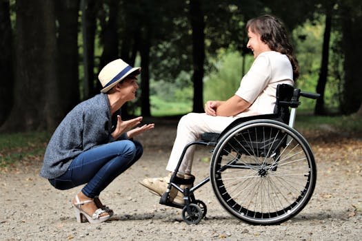 Two women enjoy a lively conversation in a sunny park, embracing friendship and happiness.